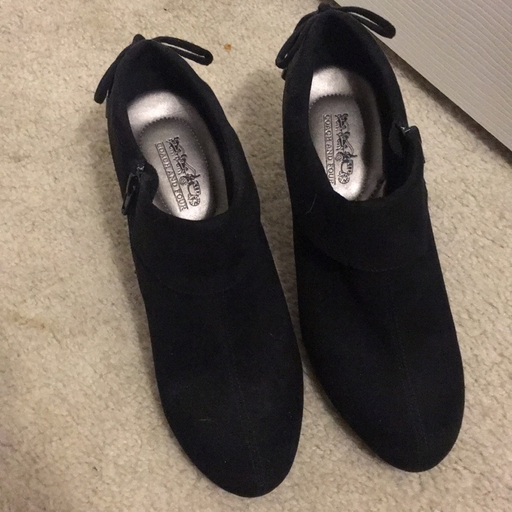 Black coach and four heels